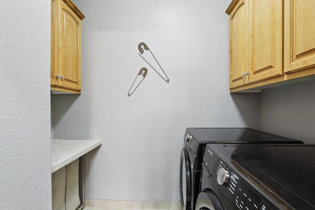 laundry area with cabinet space and washing machine and dryer