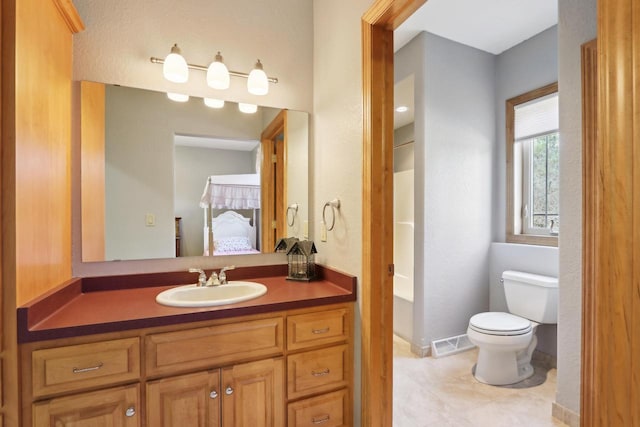 bathroom with visible vents, toilet, ensuite bathroom, tile patterned floors, and vanity