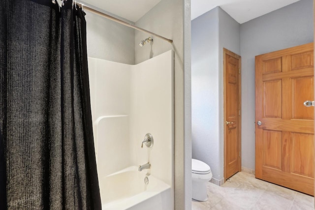 bathroom with tile patterned floors, toilet, and shower / bathtub combination with curtain