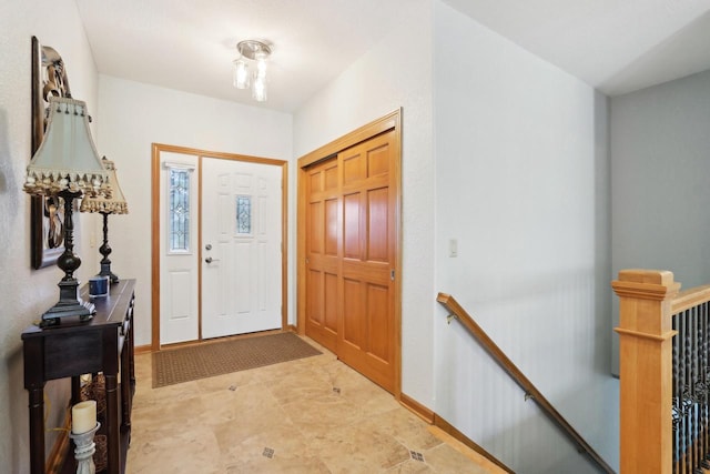 foyer entrance with baseboards