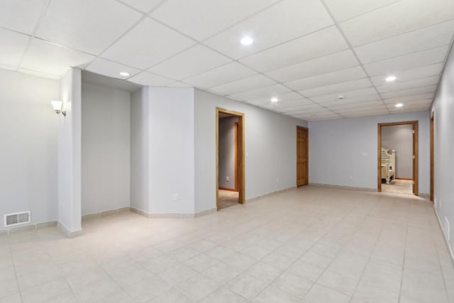 below grade area with visible vents, recessed lighting, a paneled ceiling, and baseboards