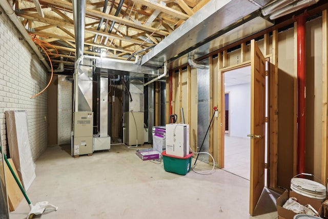 unfinished basement featuring brick wall