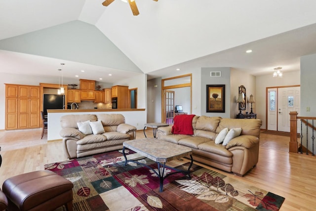 living area featuring light wood finished floors, visible vents, recessed lighting, high vaulted ceiling, and a ceiling fan