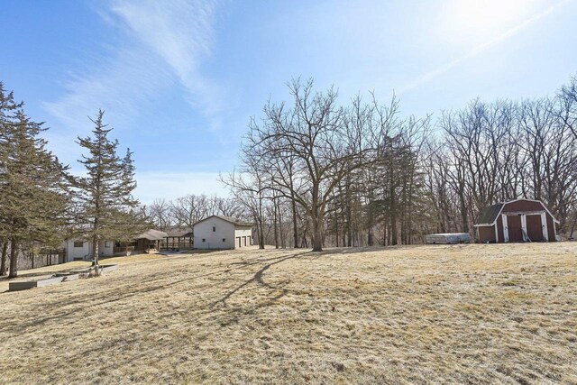 view of yard with a barn and an outdoor structure