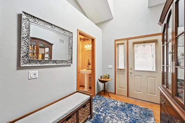 entrance foyer with visible vents and wood finished floors