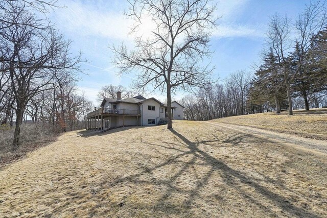 exterior space with a chimney and a deck