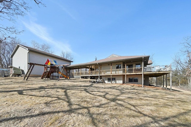 back of house featuring a wooden deck