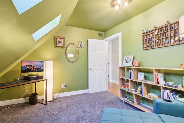 recreation room featuring lofted ceiling with skylight, baseboards, visible vents, and carpet floors