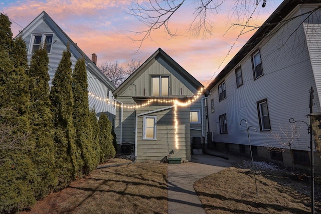 rear view of property with board and batten siding