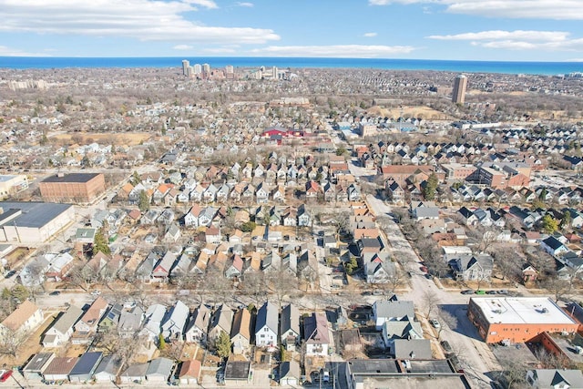 birds eye view of property with a residential view and a water view