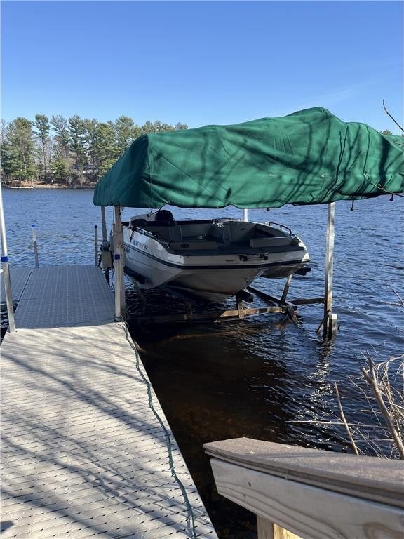 view of dock with a water view and boat lift