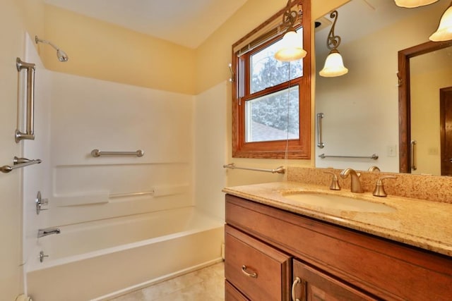 bathroom with vanity and washtub / shower combination