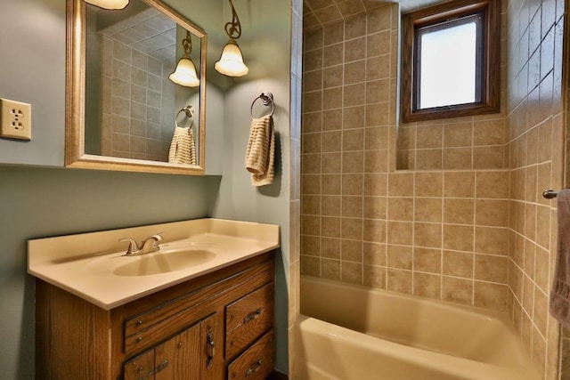 bathroom with vanity and shower / tub combination