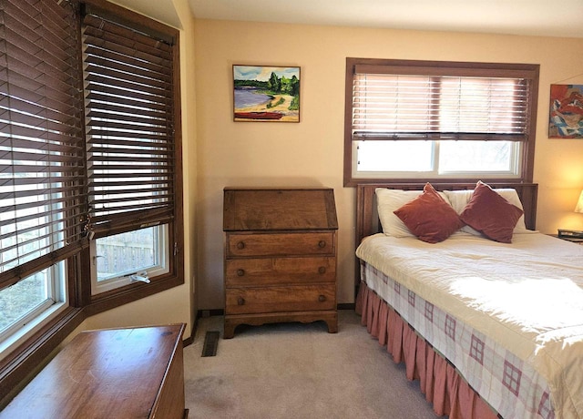 bedroom with light colored carpet