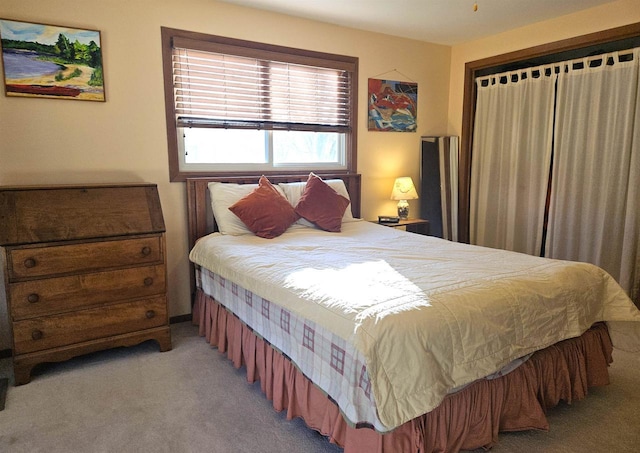 bedroom with light colored carpet