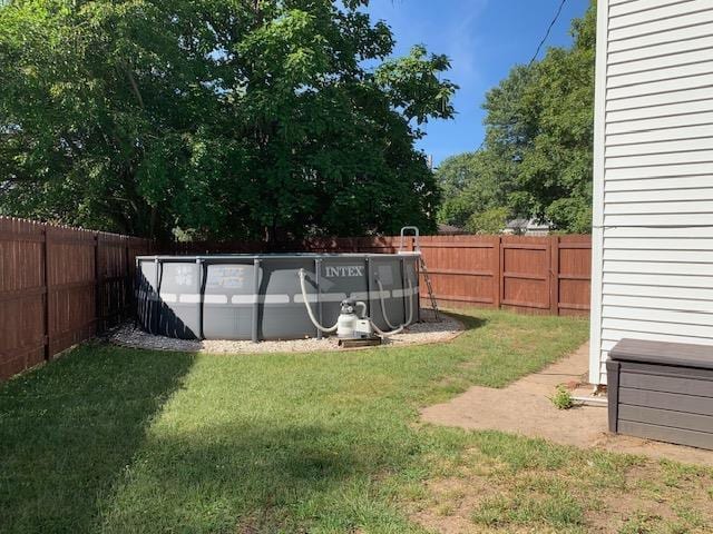 view of yard with a fenced in pool and a fenced backyard