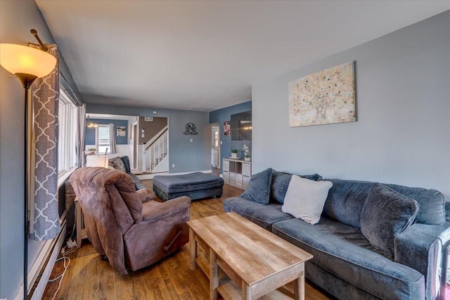 living room featuring stairway and wood finished floors