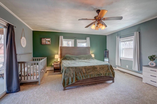 bedroom featuring baseboards, carpet floors, ceiling fan, ornamental molding, and baseboard heating