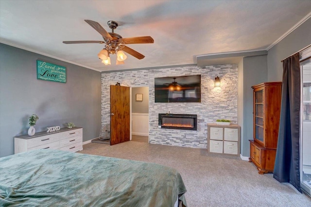 bedroom with a stone fireplace, crown molding, and carpet floors