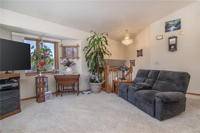 carpeted living area featuring lofted ceiling, an inviting chandelier, and baseboards