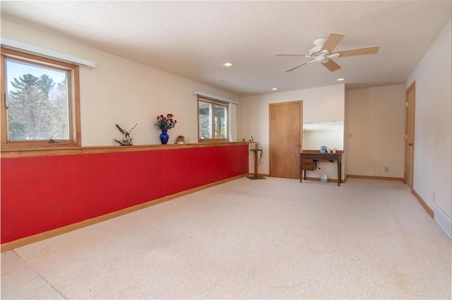 carpeted empty room featuring a ceiling fan, recessed lighting, a textured ceiling, and baseboards