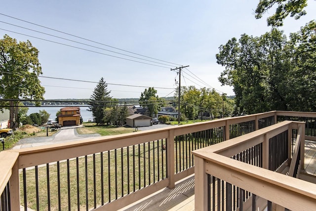 wooden deck featuring a lawn and a fireplace