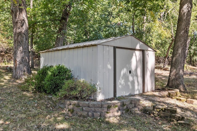 view of shed featuring a wooded view