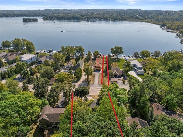 aerial view featuring a residential view and a water view