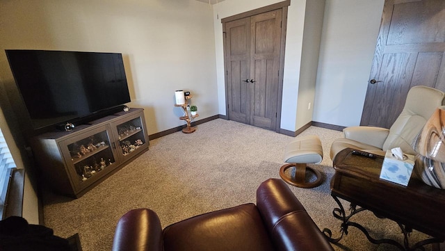 living room with carpet and baseboards