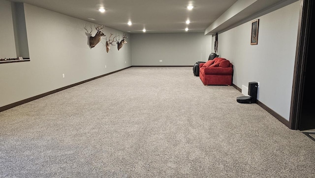 interior space with light carpet, baseboards, and recessed lighting