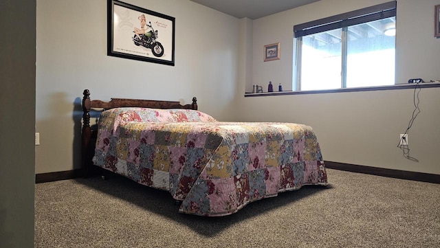 bedroom with carpet floors and baseboards