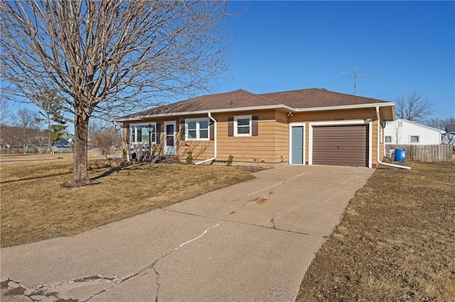 single story home featuring a garage, driveway, a front lawn, and fence