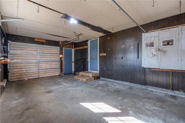 garage featuring wooden walls