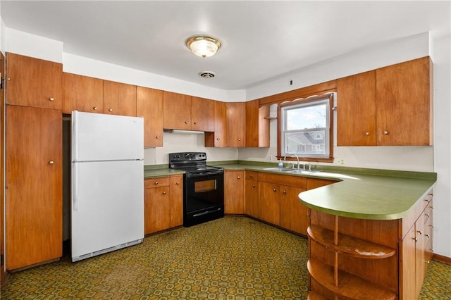 kitchen featuring open shelves, visible vents, freestanding refrigerator, a sink, and black range with electric cooktop