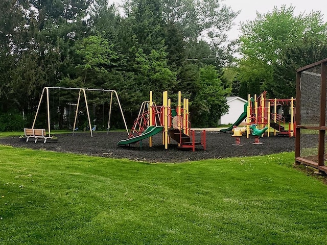 community jungle gym with a lawn