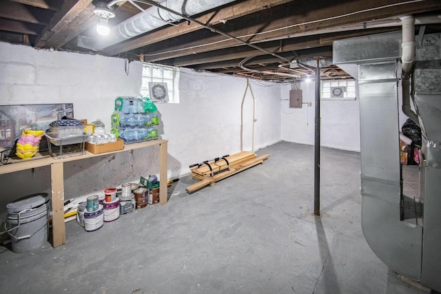 basement with a wealth of natural light and electric panel