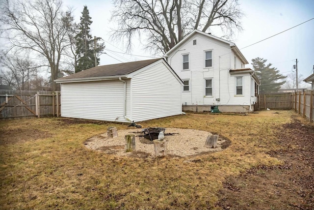 back of house featuring a fenced backyard