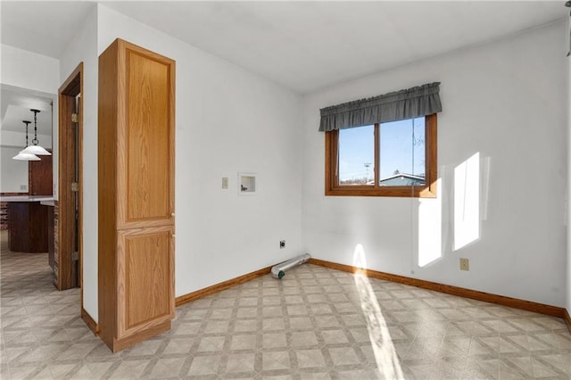 laundry area with light floors, hookup for a washing machine, baseboards, and electric dryer hookup