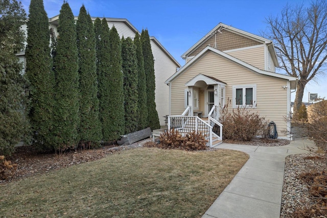 view of front of home with a front lawn