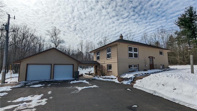 14091 W County Highway B, Hayward, WI 54843 - view of front of house with an attached garage and a chimney