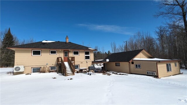 14091 W County Highway B, Hayward, WI 54843 - snow covered back of property with ac unit and a chimney