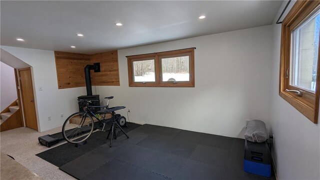 14091 W County Highway B, Hayward, WI 54843 - workout area featuring a wood stove, carpet flooring, a wealth of natural light, and recessed lighting