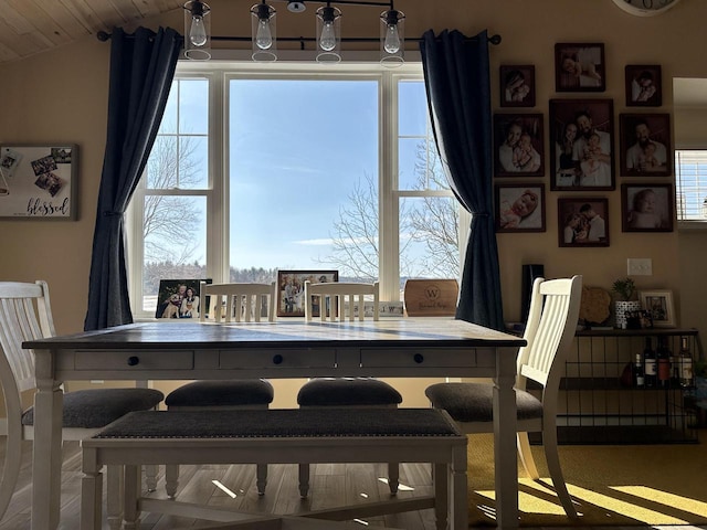 dining room with vaulted ceiling