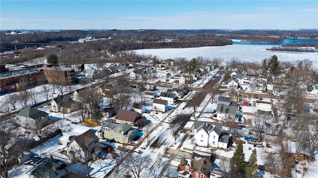 snowy aerial view with a residential view