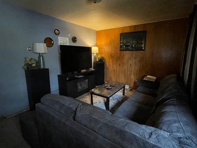 living room featuring wooden walls