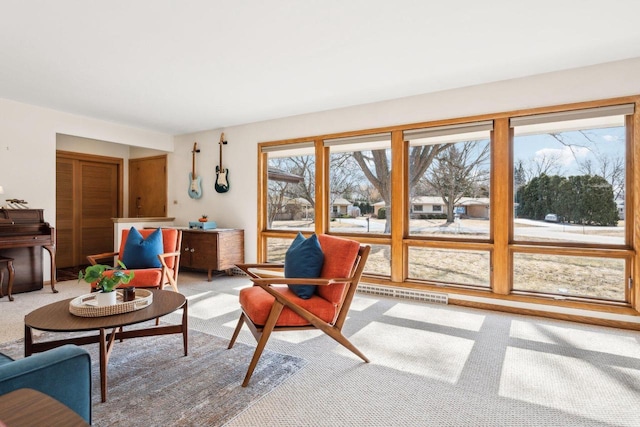 living area featuring visible vents and light carpet