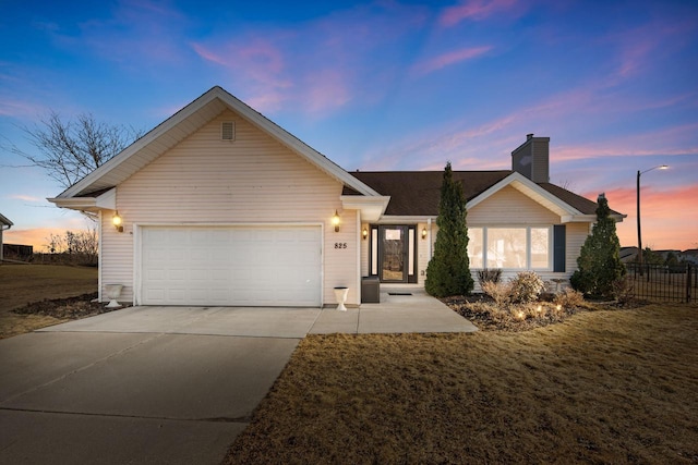 ranch-style house with concrete driveway, an attached garage, fence, and a chimney