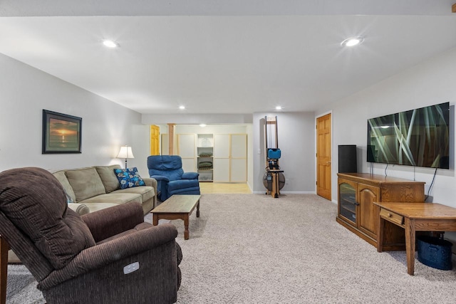 living room featuring recessed lighting, light colored carpet, and baseboards