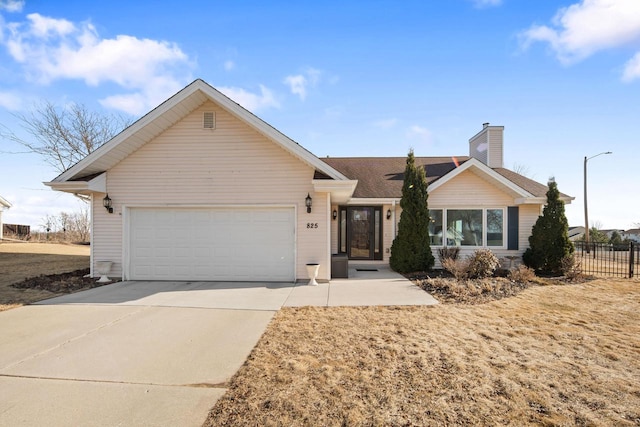 ranch-style home with a chimney, concrete driveway, a garage, and fence