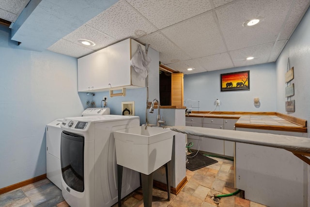 laundry area with recessed lighting, cabinet space, baseboards, and washer and clothes dryer